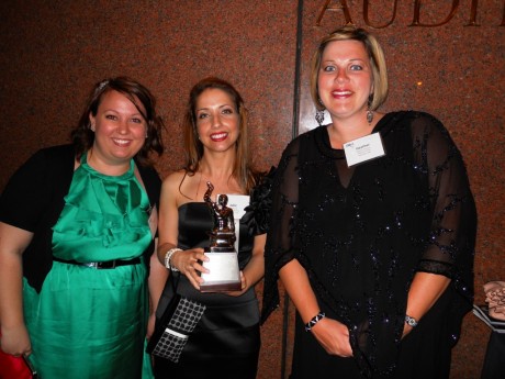 Rachel Lewis, Julie Russo and Heather Blausey pose with the award